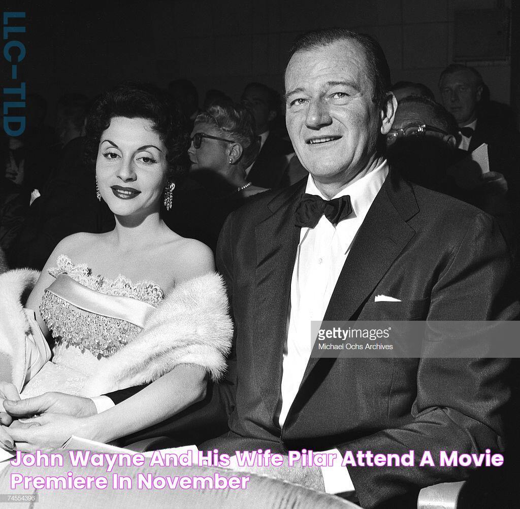 John Wayne and his wife Pilar attend a movie premiere in November