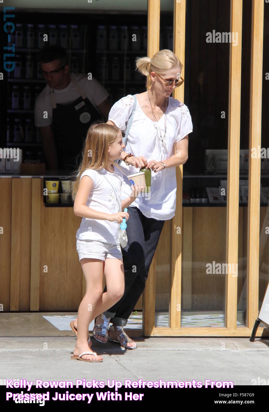 Kelly Rowan picks up refreshments from Pressed Juicery with her