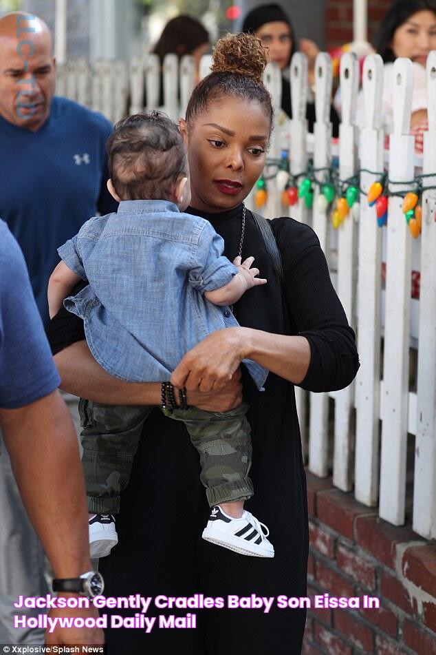 Jackson gently cradles baby son Eissa in Hollywood Daily Mail