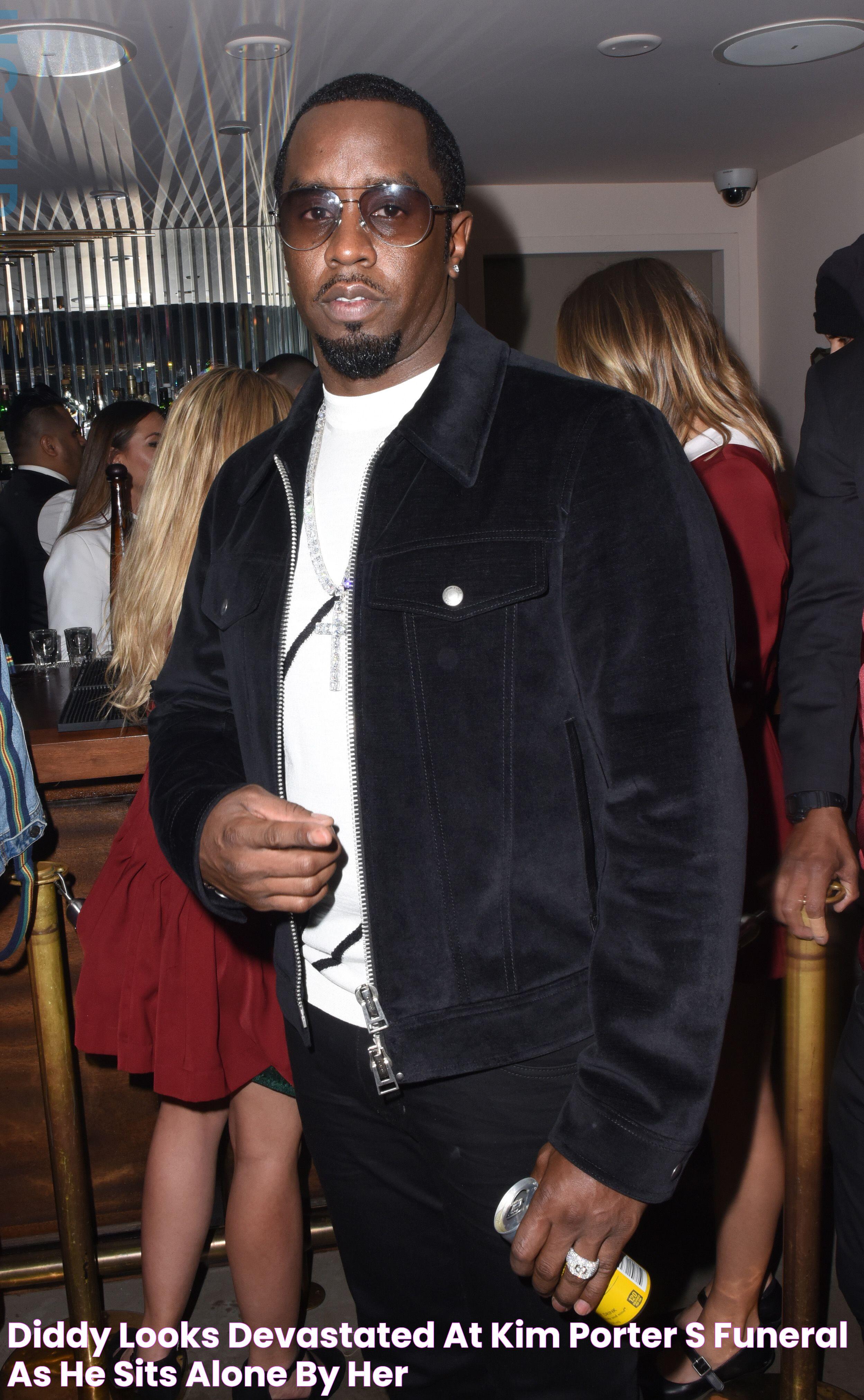 Diddy Looks Devastated At Kim Porter's Funeral As He Sits Alone By Her